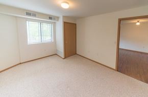 Owatonna apartment for rent - an empty room with a door and a window