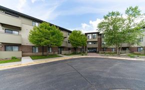 Owatonna apartment for rent - an empty street in front of an apartment building