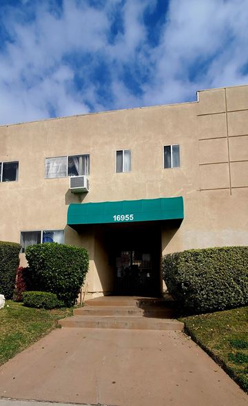 Granada Hills apartment for rent - an office building with a green awning on the front of it