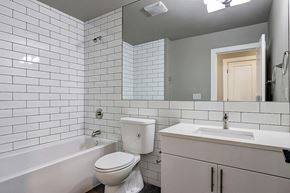 Seattle apartment for rent - a white bathroom with a toilet sink and tub
