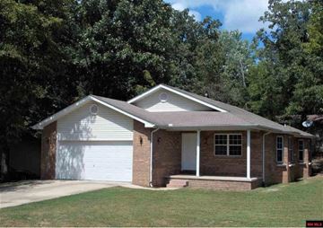 Mountain Home house for rent - a small brick house with a white garage door