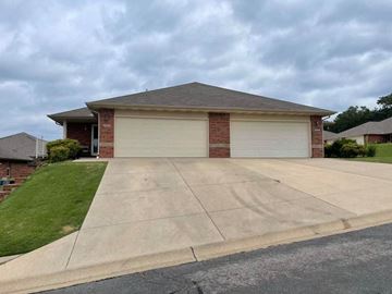 Mountain Home house for rent - A house with a grey roof and a grey garage door.