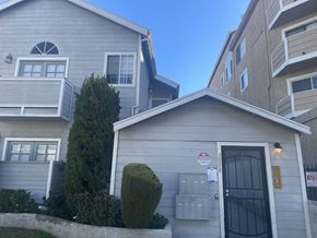 N. Hollywood apartment for rent - a white house with a street sign on the side of it