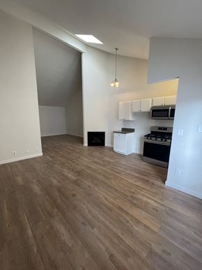 N. Hollywood apartment for rent - an empty living room and kitchen with wood flooring