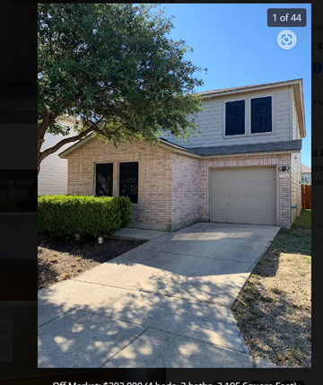 San Antonio house for rent - a white brick house with a garage and a tree