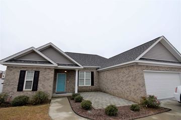 Florence house for rent - a brick house with a blue door and a driveway