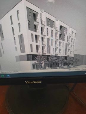 Toronto apartment for rent - a picture of a building on the screen of a tv
