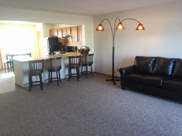 Cleves apartment for rent - a living room and kitchen with a couch and a table