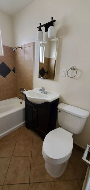 Valley Village apartment for rent - a small bathroom with a toilet sink and tub