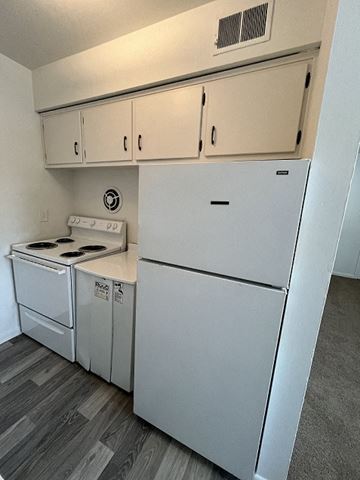 Newport News apartment for rent - a kitchen with white appliances and white cabinets