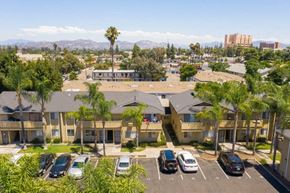 El Cajon apartment for rent - an aerial view of an apartment complex with cars parked in a parking lot