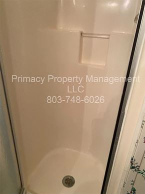 Andrews house for rent - A Primacy Property Management LLC sign is on a bathroom wall.