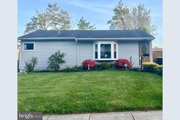 Wilmington house for rent - A house with a grey roof and a green lawn in front.