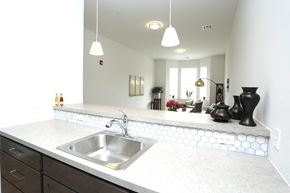 Aberdeen apartment for rent - A kitchen with a white counter top and a stainless steel sink.