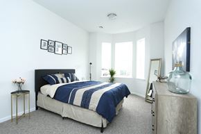Aberdeen apartment for rent - A bedroom with a bed, nightstand, and a window.