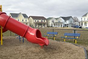 Bridgeton apartment for rent - A red slide in a playground with houses in the background.