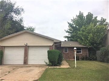 Oklahoma City house for rent - a house with a driveway and a garage