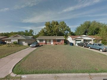 Oklahoma City house for rent - a neighborhood of houses with cars parked in front of them