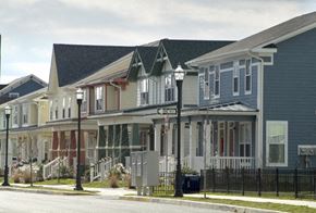 Bridgeton apartment for rent - A row of houses with a black fence in front.