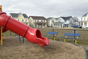Bridgeton apartment for rent - A red slide in a playground with houses in the background.