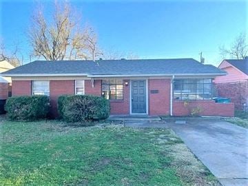 Oklahoma City house for rent - a red brick house with a blue door