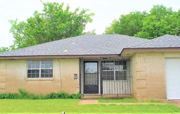Oklahoma City house for rent - the front of a brick house with a garage door