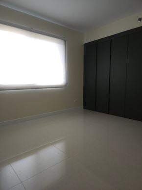 Mangilao apartment for rent - A room with a window and a wall-mounted cabinet.