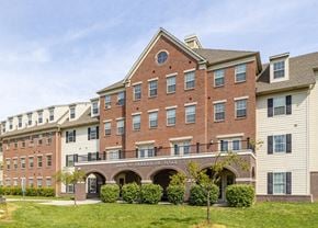 Camden apartment for rent - the front of a brick building with a green lawn