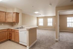 Camden apartment for rent - an empty kitchen and living room with an open door