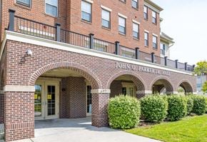 Camden apartment for rent - the front of a brick building with a sidewalk