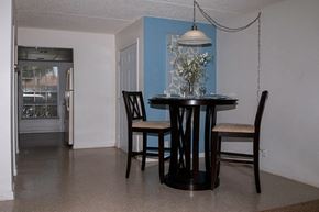 Kissimmee apartment for rent - a dining room with a table and chairs