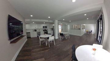 Cleveland apartment for rent - an open living room and kitchen with tables and chairs