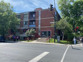 Montreal apartment for rent - a red brick building on the corner of a street