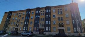 Cleveland apartment for rent - a brick building with cars parked in front of it