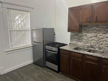 Cleveland apartment for rent - a kitchen with a sink and a refrigerator
