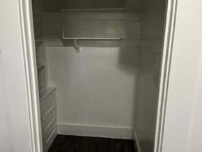 Cleveland apartment for rent - a small closet with a white wall and a white