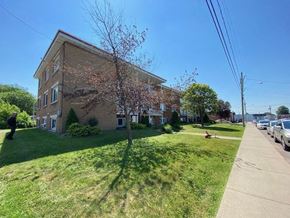 Granby apartment for rent - a large brick building on the side of a sidewalk
