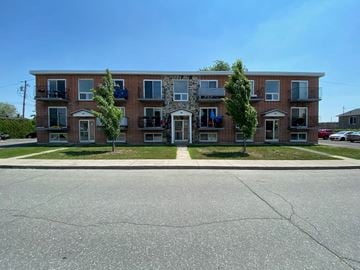 Granby apartment for rent - a red brick apartment building on the side of a street