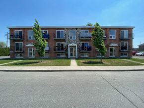 Granby apartment for rent - a red brick apartment building with trees in front