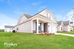 Greenville house for rent - a house with a lawn in front of it