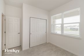 Bartow house for rent - a bedroom with two doors and a window and a door to a closet