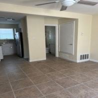 Copperas Cove apartment for rent - A kitchen with tile flooring and a ceiling fan.
