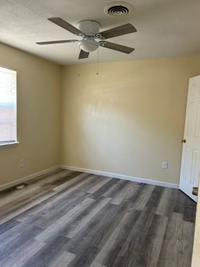 Copperas Cove apartment for rent - A room with a ceiling fan and wooden flooring.