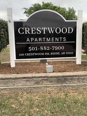 Beebe apartment for rent - A sign for Crestwood Apartments with a phone number and address.