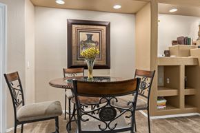 Oro Valley house for rent - a dining room with a table and chairs and a painting on the wall