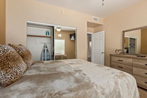 Oro Valley house for rent - a bedroom with a bed and a dresser and a closet