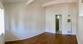 Santa Barbara apartment for rent - a living room with white walls and a wooden floor