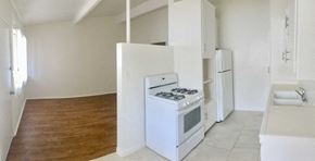 Santa Barbara apartment for rent - an empty kitchen with a stove and a refrigerator