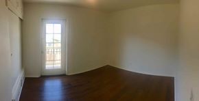 Carpinteria apartment for rent - A room with a window and wooden floors.