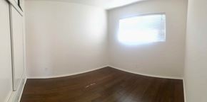 Carpinteria apartment for rent - A room with a window and wooden flooring.